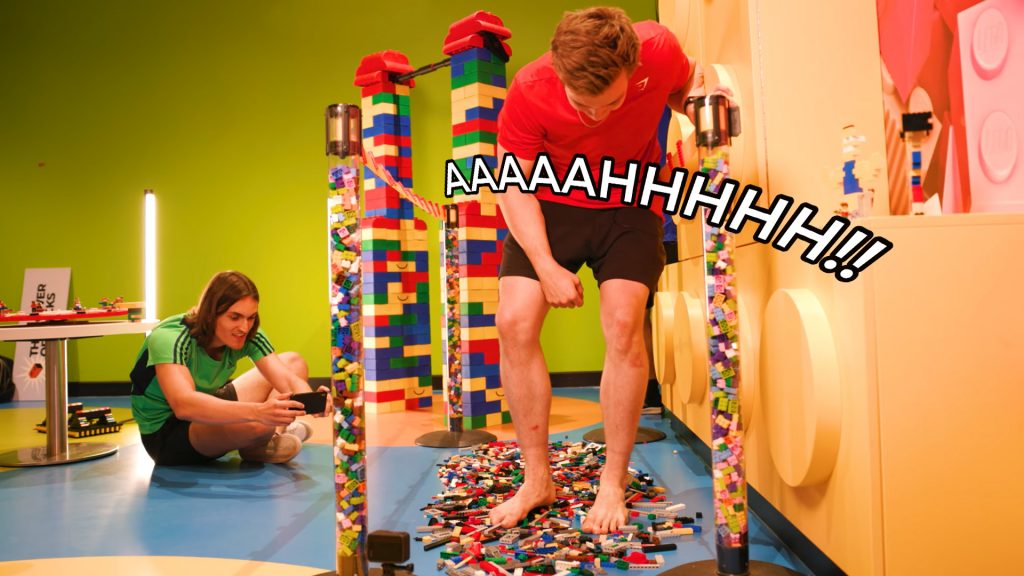 "The Lego Walk Of Death" - Stan Browney walking over Lego bricks